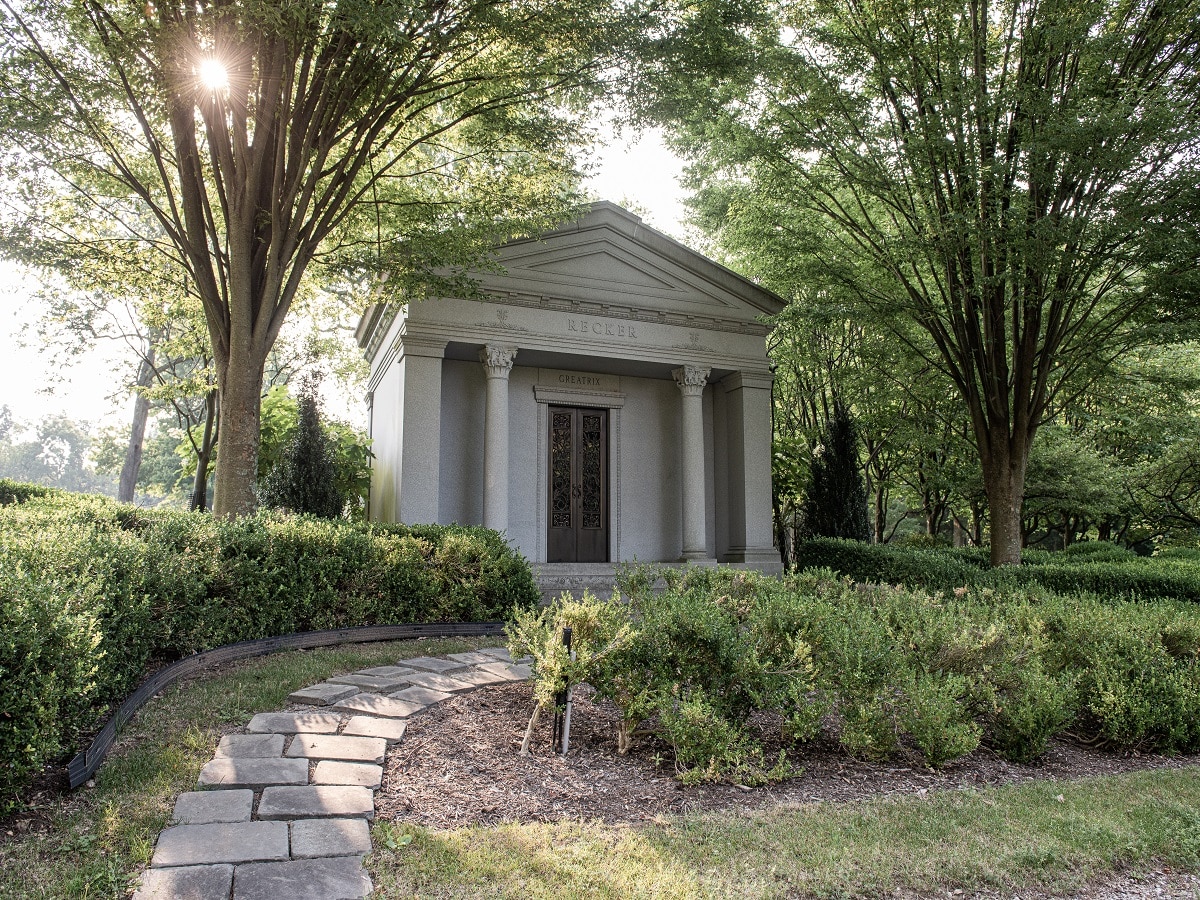 Dio + Co. custom luxury mausoleum surrounded by trees (private family mausoleum)