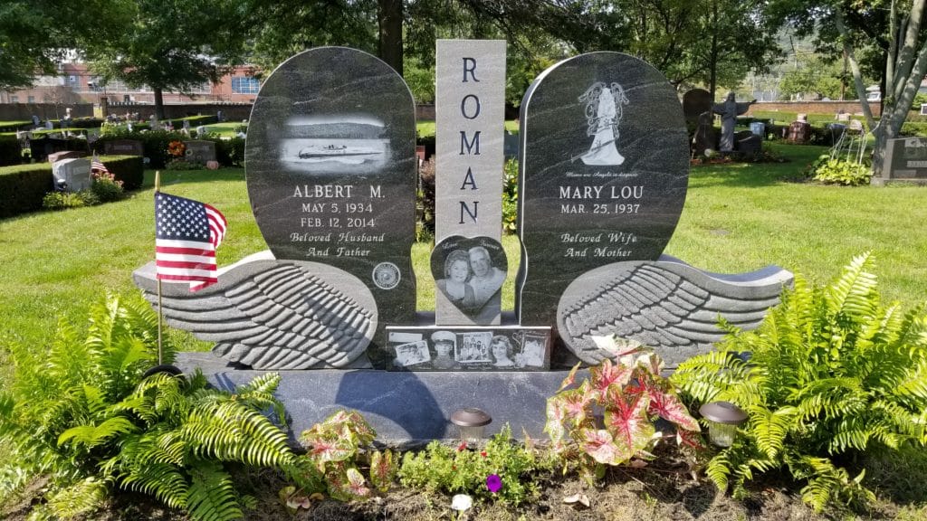 Upright monument with multiple stones and artwork. Quotes and custom lettering written in granite can represent a lot.