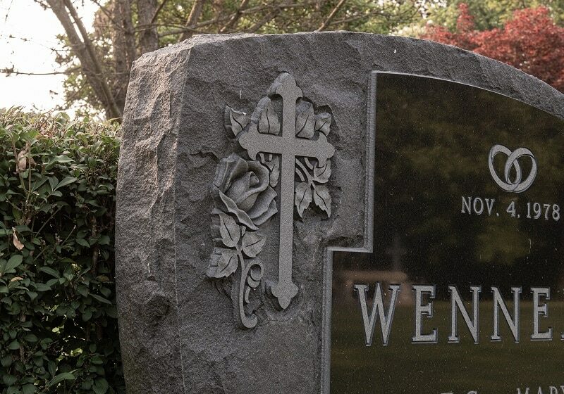 Upright headstone with faith etchings