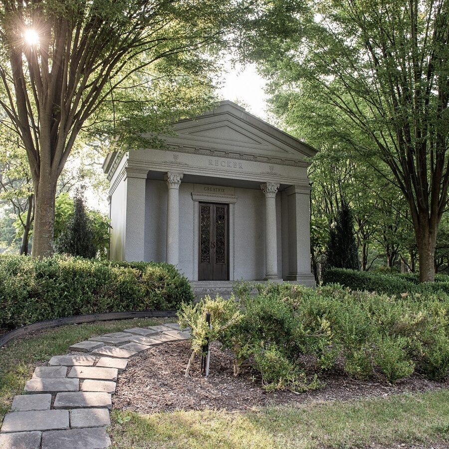 Dio + Co. custom luxury mausoleum surrounded by trees (private family mausoleum)