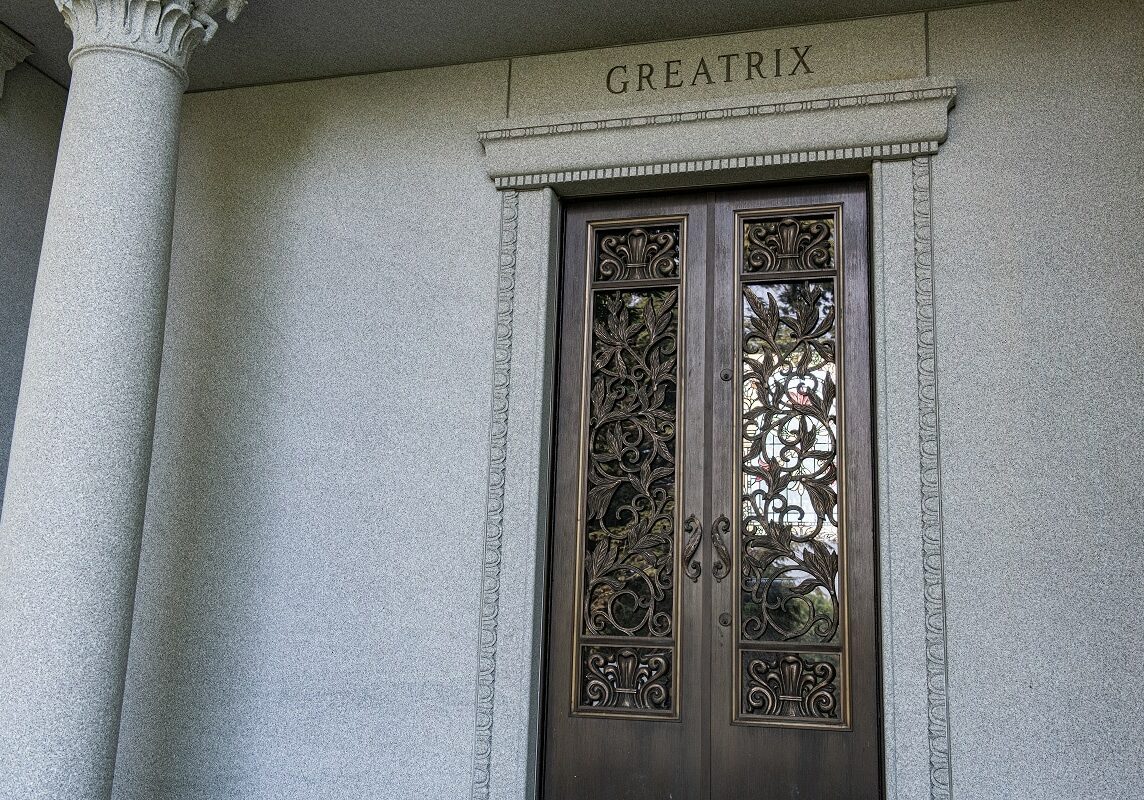 Classically styled estate mausoleum with stained glass doors