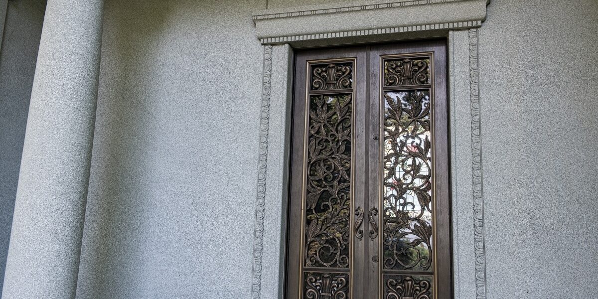 Classically styled estate mausoleum with stained glass doors