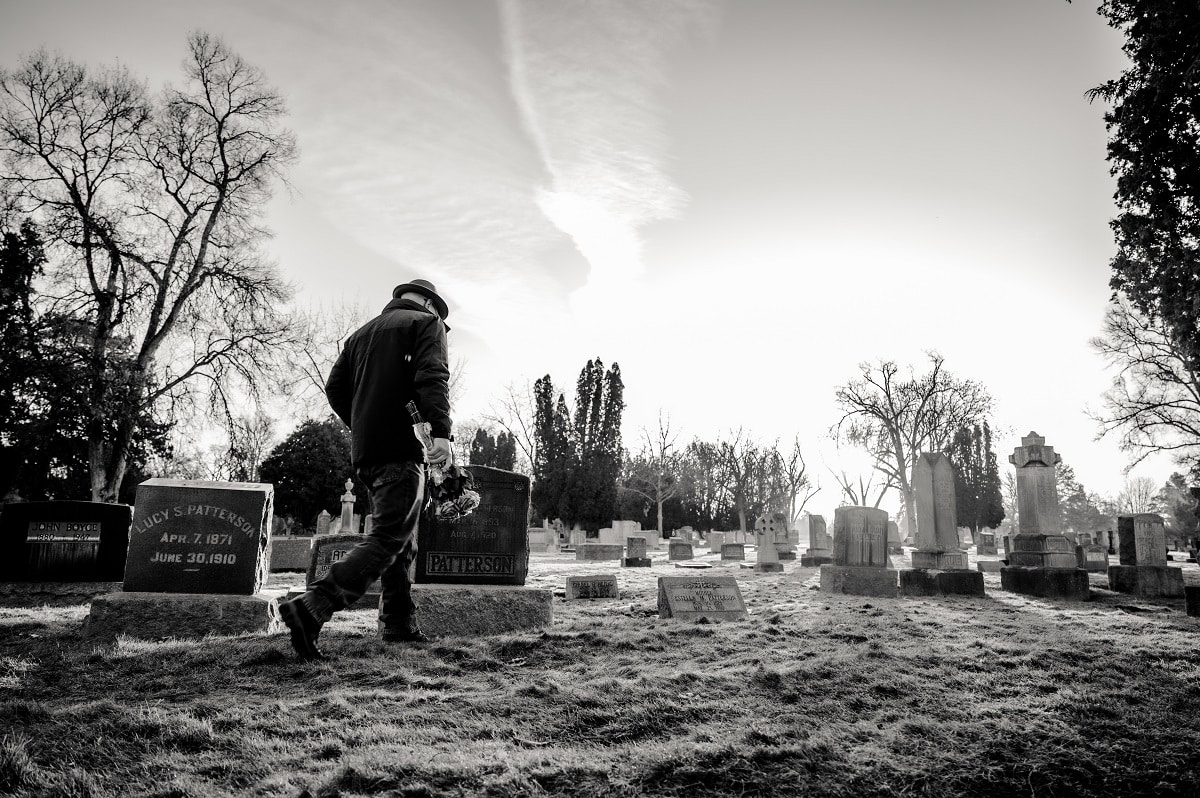 Man walking in cemetery